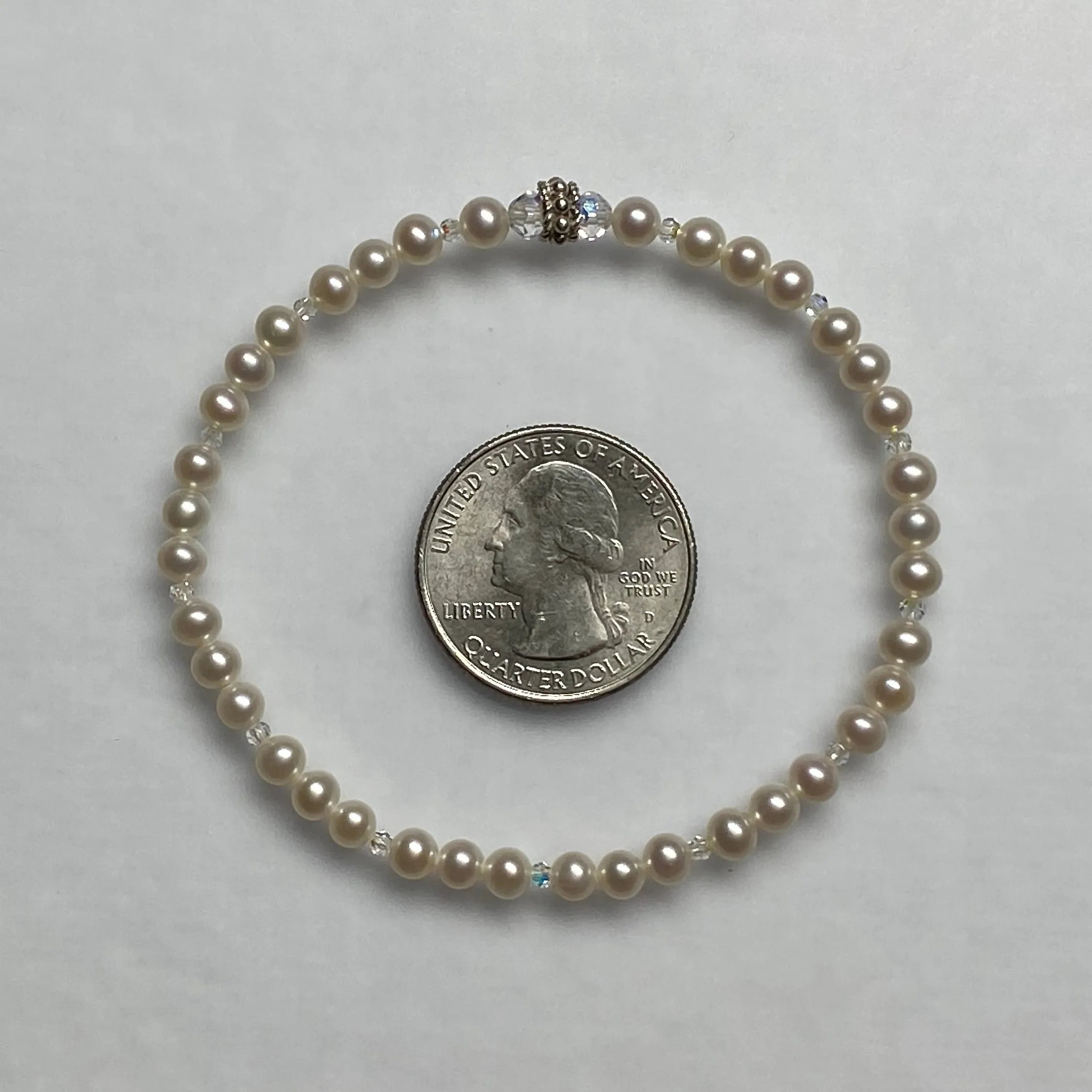 7.25" stretch bracelet with 4-4.5mm round white cultured freshwater pearls & Swarovski crystal