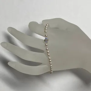 7.25" stretch bracelet with 4-4.5mm round white cultured freshwater pearls & Swarovski crystal