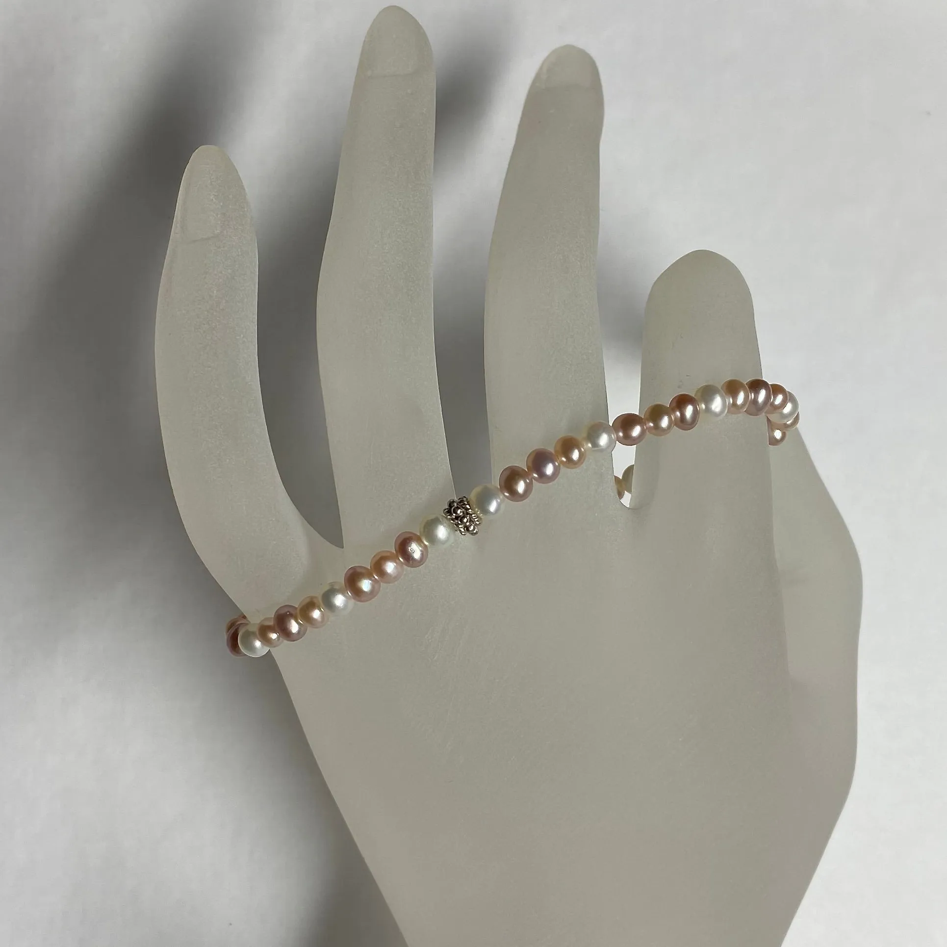 Arpaia 7.25" stretch bracelet with 4-4.5mm white and natural pink and purple cultured freshwater pearls