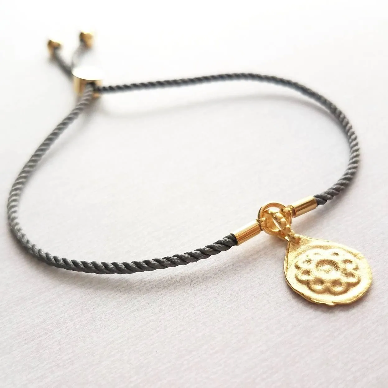 Rope Bracelet, matte gold heart charm, grey twisted cord, thin string, gold medallion, adjustable gray cord silky stacking layering bracelet
