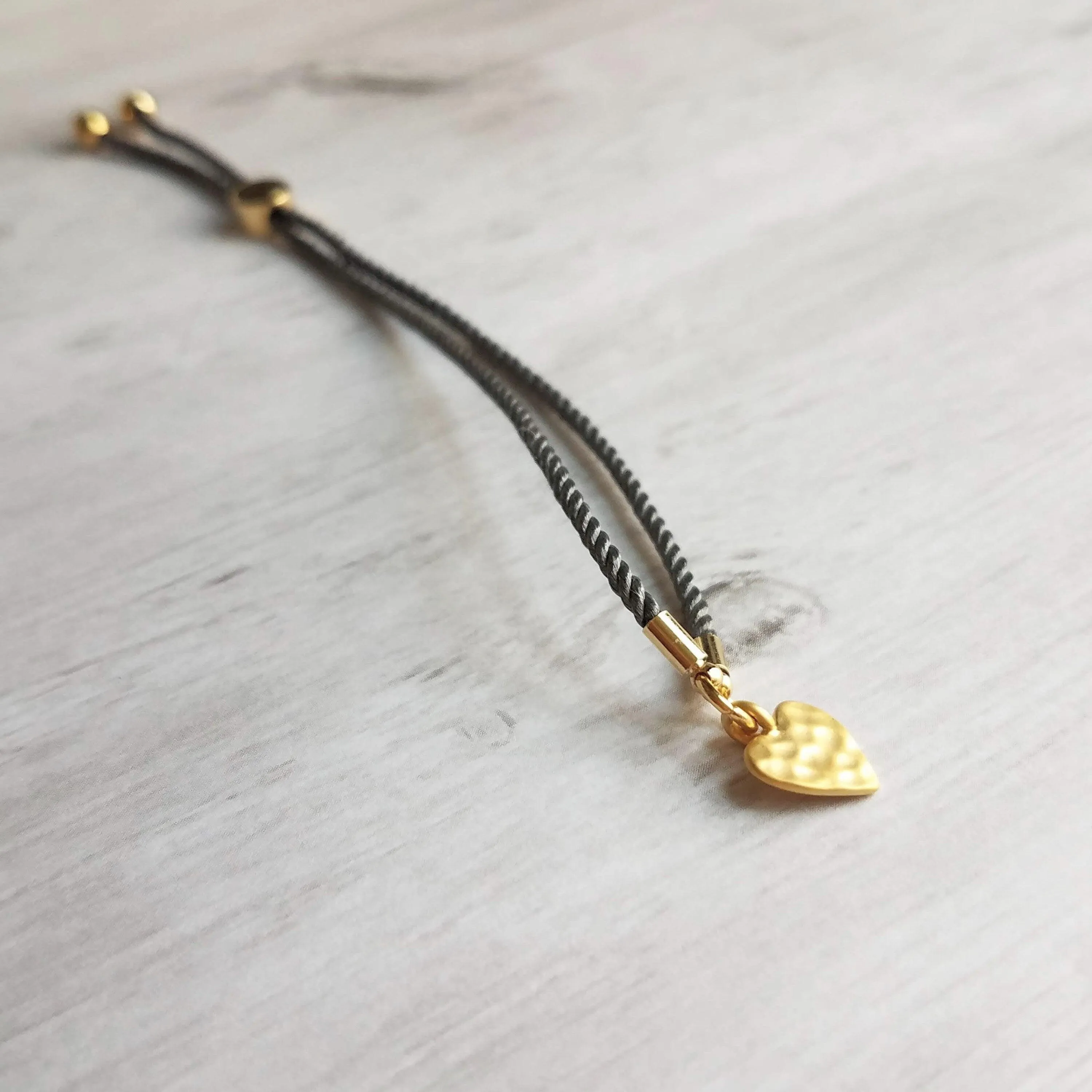 Rope Bracelet, matte gold heart charm, grey twisted cord, thin string, gold medallion, adjustable gray cord silky stacking layering bracelet