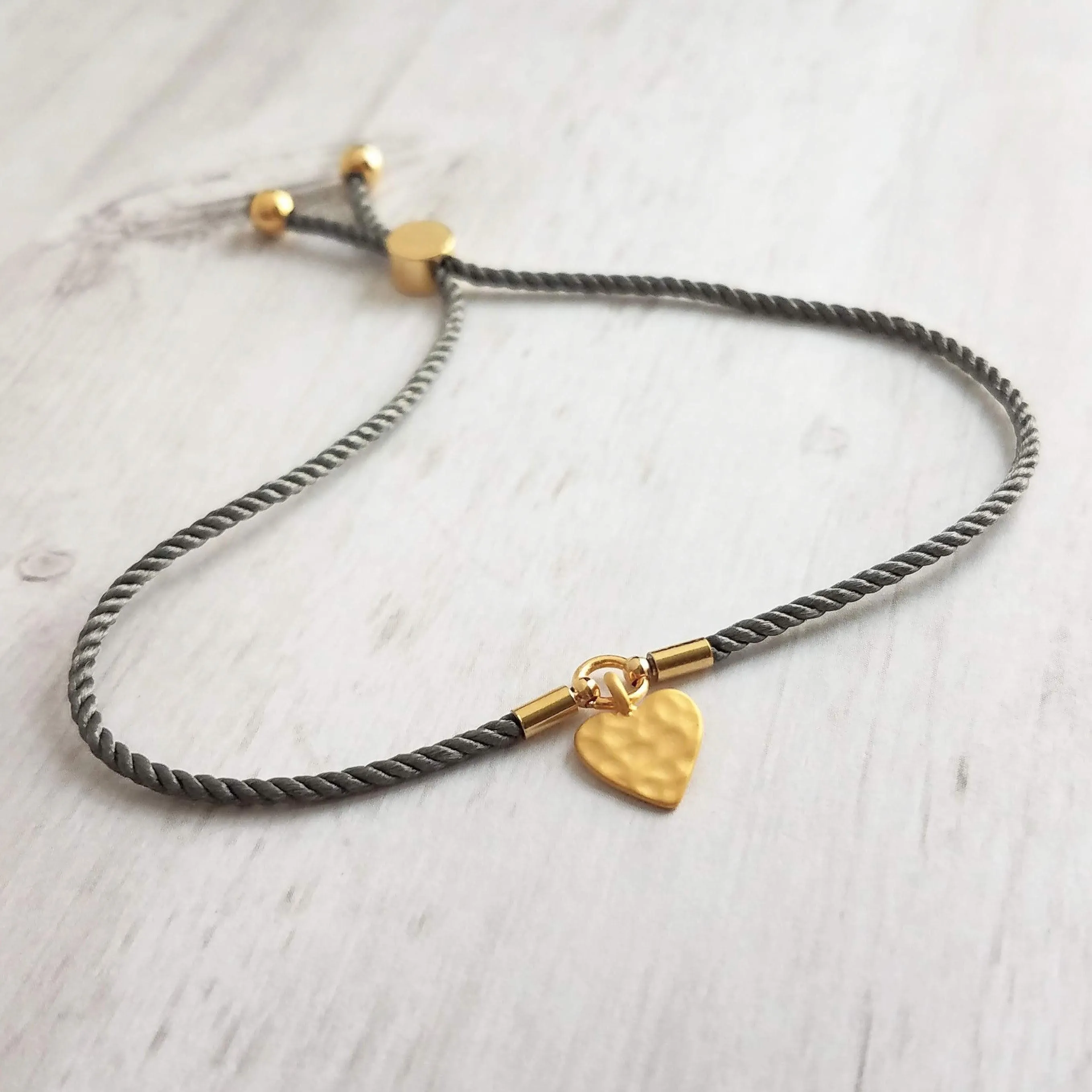 Rope Bracelet, matte gold heart charm, grey twisted cord, thin string, gold medallion, adjustable gray cord silky stacking layering bracelet