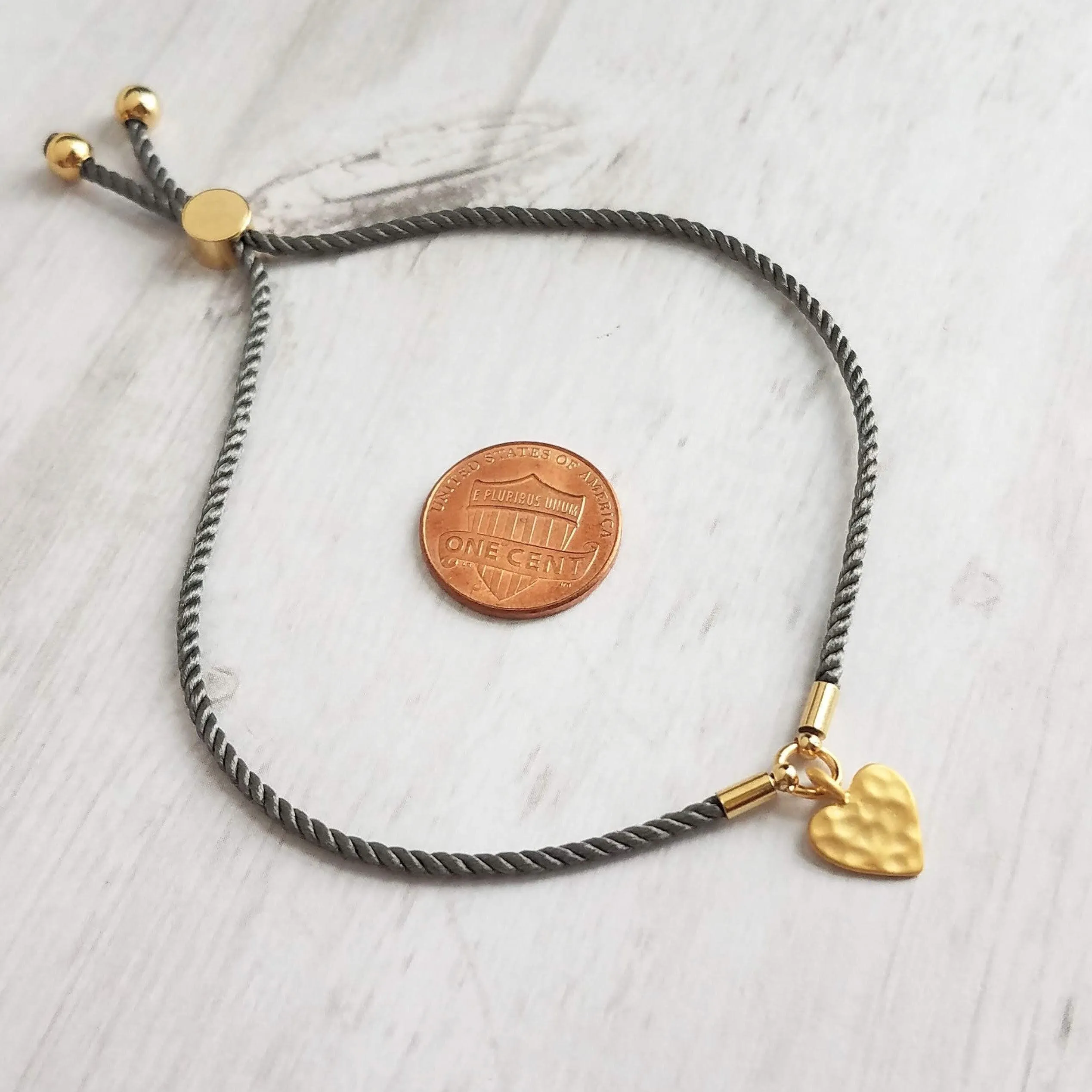 Rope Bracelet, matte gold heart charm, grey twisted cord, thin string, gold medallion, adjustable gray cord silky stacking layering bracelet