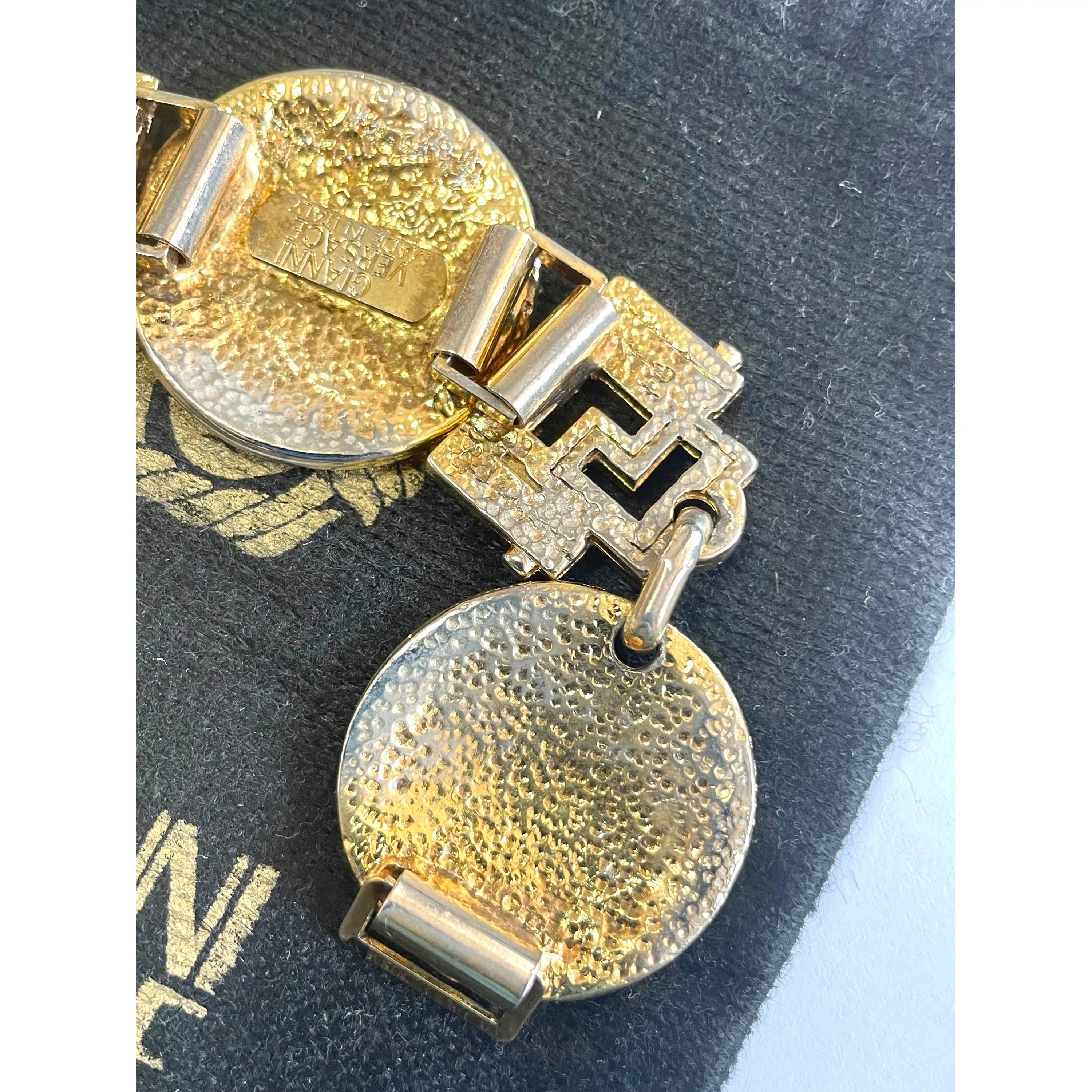 Vintage Gianni Versace gold tone medusa face motif bracelet with crystals. Must have Lady Gaga style jewelry piece. 060308m