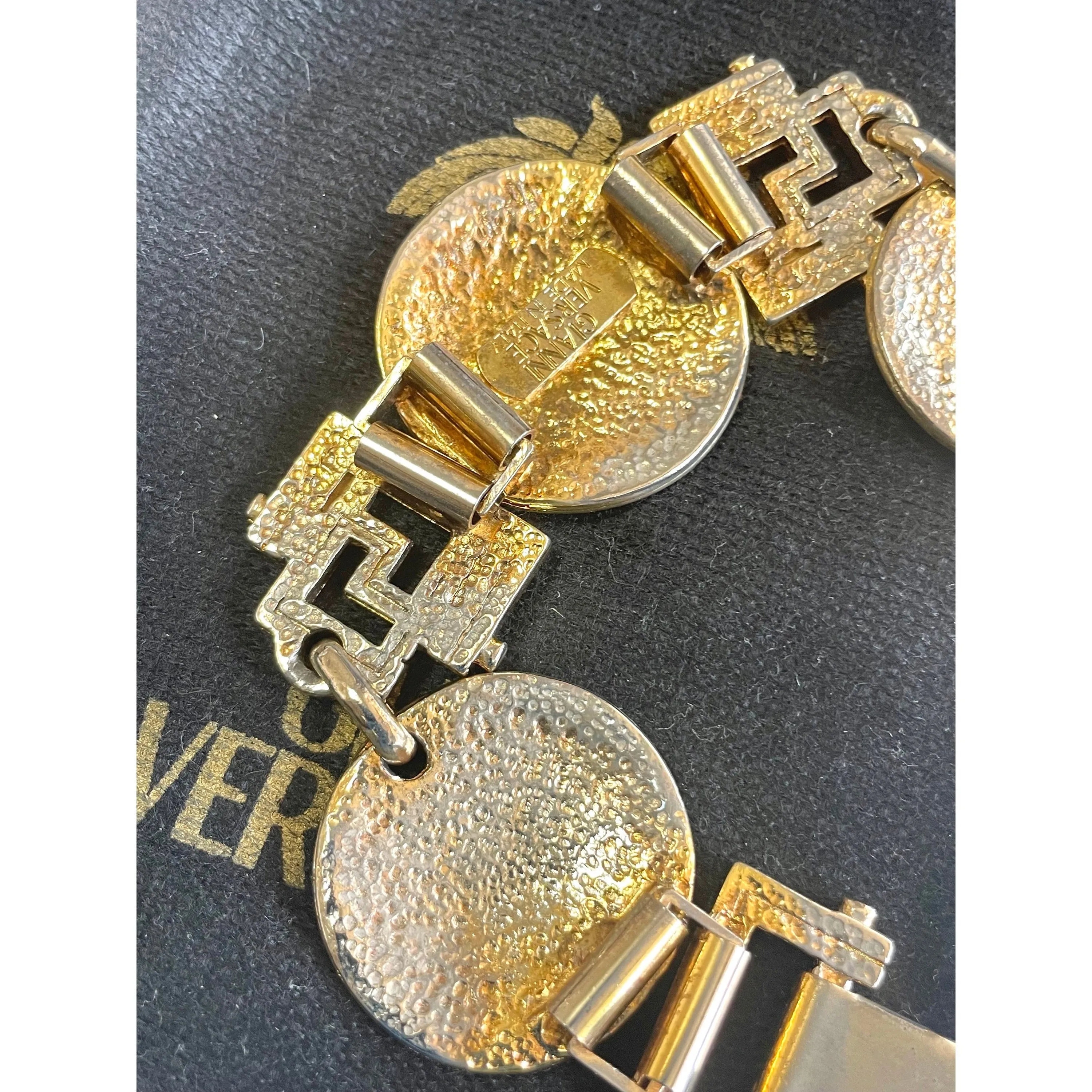 Vintage Gianni Versace gold tone medusa face motif bracelet with crystals. Must have Lady Gaga style jewelry piece. 060308m